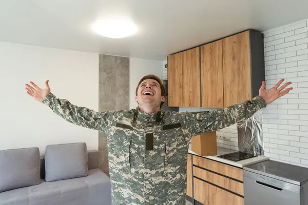 Happy service man in kitchen